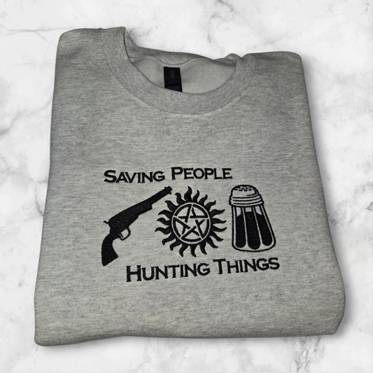 Custom made to order Supernatural sweatshirt. Saving people, hunting things. Colt, anti-possession symbol and salt shaker.