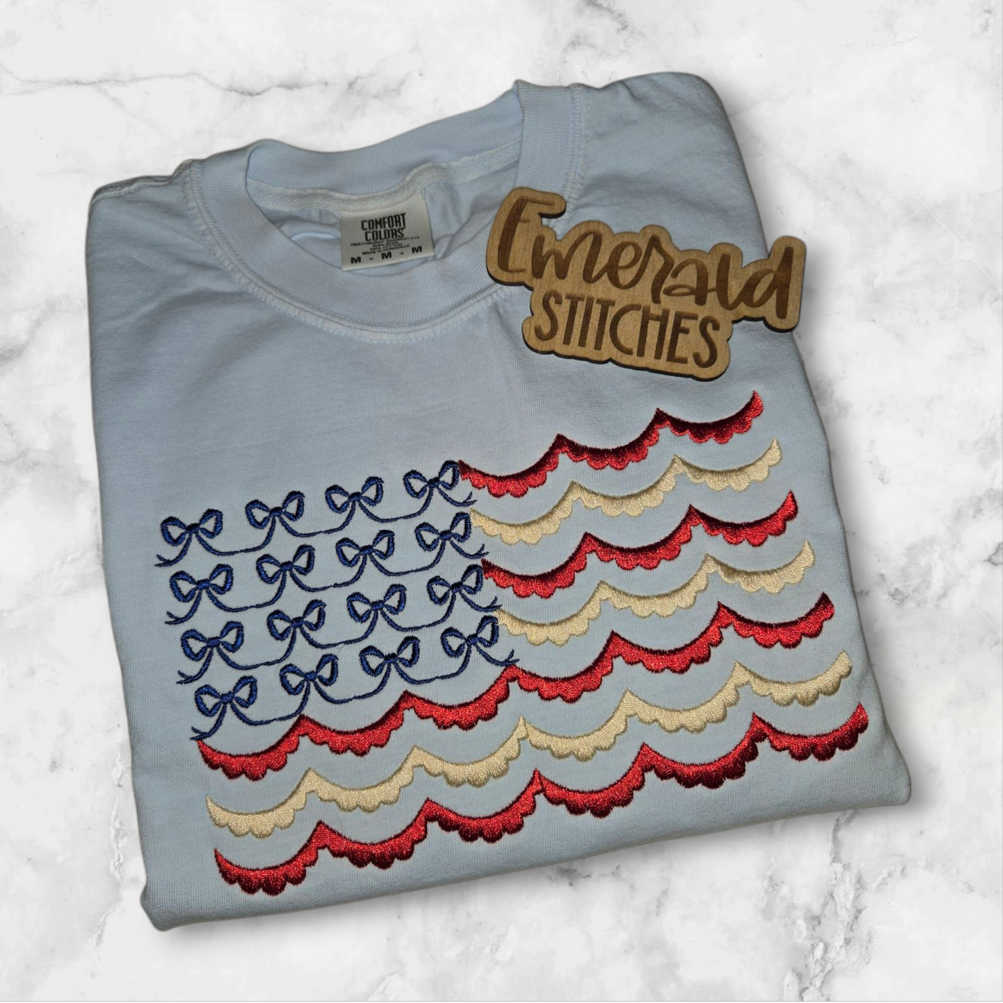 Embroidered scallop flag and bow short sleeve tshirt.