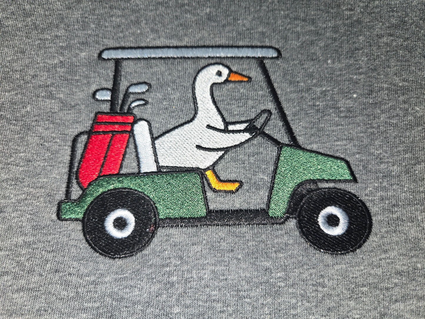 Golf cart driving goose. Customizable made to order, embroidered crewneck.